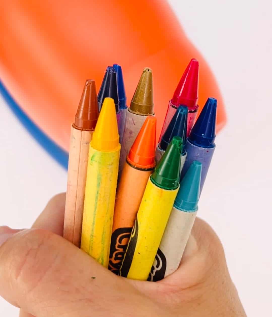 Close-up detail of sharp colourful pencil crayons laid side by